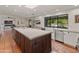 Spacious kitchen with a large island, stainless appliances, and farmhouse sink at 7921 N 54Th St, Paradise Valley, AZ 85253