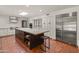 Open kitchen featuring a large island, white cabinets, and stainless refrigerator at 7921 N 54Th St, Paradise Valley, AZ 85253