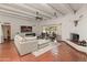 Spacious living room with tile floors, fireplace, and access to the outdoor area at 7921 N 54Th St, Paradise Valley, AZ 85253