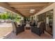 Comfortable outdoor patio featuring stylish wicker furniture and a covered space, perfect for relaxing and entertaining guests at 7921 N 54Th St, Paradise Valley, AZ 85253