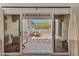 Inviting covered patio featuring tiled flooring, built-in seating, and desert views perfect for outdoor relaxation at 7921 N 54Th St, Paradise Valley, AZ 85253