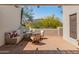 Charming patio area with terracotta tile, built-in seating, and views of desert landscape at 7921 N 54Th St, Paradise Valley, AZ 85253