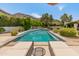 Backyard swimming pool with lounge chairs, complemented by desert landscaping and mountain views in the background at 7921 N 54Th St, Paradise Valley, AZ 85253