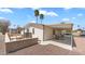 Backyard view featuring the patio area, landscaping, and the exterior of the home at 8103 E Southern Ave # 154, Mesa, AZ 85209