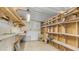 A clean and spacious basement equipped with storage shelving, work bench and pegboard at 8103 E Southern Ave # 154, Mesa, AZ 85209