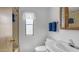 Bright bathroom with white fixtures, updated vanity, and a decorative wood-framed medicine cabinet above the toilet at 8103 E Southern Ave # 154, Mesa, AZ 85209