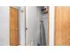 Storage closet with shelving and space for an ironing board and other household items at 8103 E Southern Ave # 154, Mesa, AZ 85209