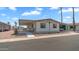 Charming single-story home with a covered carport, desert landscaping, and a welcoming curb appeal at 8103 E Southern Ave # 154, Mesa, AZ 85209