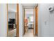 Hallway view showcasing access to the bedroom and living area, with neutral-toned walls and flooring at 8103 E Southern Ave # 154, Mesa, AZ 85209