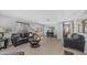 Inviting living room featuring cozy seating, a round coffee table, and access to the outdoor patio at 8103 E Southern Ave # 154, Mesa, AZ 85209