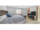 Cozy main bedroom with a queen bed, closet access, and comfortable decor at 8103 E Southern Ave # 154, Mesa, AZ 85209