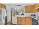 Updated kitchen features wood cabinetry, modern appliances, and a convenient layout at 8103 E Southern Ave # 222, Mesa, AZ 85209