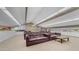 Large living room featuring multiple leather sofas, a coffee table, and bright, natural light at 8103 E Southern Ave # 222, Mesa, AZ 85209