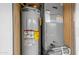 Image showcases the home's utility area, featuring a well-maintained water heater and HVAC system for optimal home comfort at 8103 E Southern Ave # 222, Mesa, AZ 85209