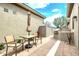 Backyard with a grill, landscaping, and a dining table at 8220 E Mohawk Ln, Scottsdale, AZ 85255