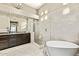 Elegant bathroom featuring soaking tub, a walk-in shower and vanity at 8220 E Mohawk Ln, Scottsdale, AZ 85255