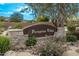Peregrine Villas community entrance sign surrounded by desert landscaping at 8220 E Mohawk Ln, Scottsdale, AZ 85255