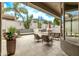 Outdoor living area boasting comfortable seating around a fireplace, perfect for entertaining or relaxing at 8220 E Mohawk Ln, Scottsdale, AZ 85255