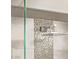 Modern shower with square shower head and mosaic tile backsplash at 8220 E Mohawk Ln, Scottsdale, AZ 85255