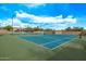 Community tennis courts on a sunny day with a blue sky at 8220 E Mohawk Ln, Scottsdale, AZ 85255