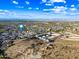 Sweeping aerial view of new construction community and surrounding desert landscape under a partly cloudy sky at 830 E Buist Ave, Phoenix, AZ 85042