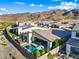 Impressive aerial perspective showcasing a modern home with a private pool, outdoor dining, and landscaped surroundings at 830 E Buist Ave, Phoenix, AZ 85042