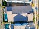 An aerial view of a home showcasing the pool, patio area, and roof at 830 E Buist Ave, Phoenix, AZ 85042