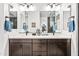 Modern bathroom featuring dual sinks, sleek cabinetry, and stylish design elements at 830 E Buist Ave, Phoenix, AZ 85042