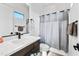 Modern bathroom showcasing a vanity with a vessel sink and sleek fixtures, plus a walk-in shower at 830 E Buist Ave, Phoenix, AZ 85042