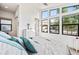 Comfortable bedroom with large windows offering natural light and views of the surrounding landscape at 830 E Buist Ave, Phoenix, AZ 85042