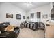 Comfortable bedroom with a ceiling fan, plush carpeting, and charming decor at 830 E Buist Ave, Phoenix, AZ 85042