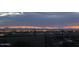 Evening city and mountain view with a patio including seating at 830 E Buist Ave, Phoenix, AZ 85042