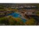 A large community pool and recreation area boasts lounge chairs and lush landscaping from an aerial view at 830 E Buist Ave, Phoenix, AZ 85042