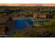 Aerial view of the community pool and recreation area with lounge chairs and lush landscaping at 830 E Buist Ave, Phoenix, AZ 85042