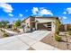 Beautiful home with a paved drive way, appealing rock landscaping and modern design elements at 830 E Buist Ave, Phoenix, AZ 85042