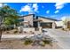 Charming single-Gathering home featuring a landscaped front yard and an attached two-car garage at 830 E Buist Ave, Phoenix, AZ 85042