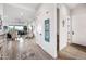 Inviting hallway with natural light and stylish decor leading to the open living area at 830 E Buist Ave, Phoenix, AZ 85042