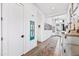 Inviting hallway with white trim, decorative rug, and front door view at 830 E Buist Ave, Phoenix, AZ 85042