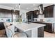 Spacious kitchen with stainless steel appliances, large island, and sleek, modern design at 830 E Buist Ave, Phoenix, AZ 85042