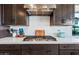 Stylish kitchen with modern appliances, stainless steel range hood, and ample counter space at 830 E Buist Ave, Phoenix, AZ 85042