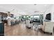 Open-concept living area with modern furnishings, seamlessly connecting the kitchen, dining, and living spaces at 830 E Buist Ave, Phoenix, AZ 85042