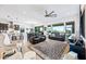 Spacious living room with an open layout and large windows offering natural light at 830 E Buist Ave, Phoenix, AZ 85042