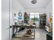Well-lit home office featuring custom cabinets, neutral colors, and tile floors at 830 E Buist Ave, Phoenix, AZ 85042