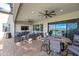 Spacious covered patio with comfortable seating and a view of the surrounding landscape at 830 E Buist Ave, Phoenix, AZ 85042