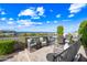 Relaxing outdoor patio featuring comfortable seating, a dining table, and scenic views of the surrounding landscape at 830 E Buist Ave, Phoenix, AZ 85042