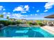 Gorgeous pool featuring stone accents, landscaping, and scenic views, creating a serene outdoor oasis at 830 E Buist Ave, Phoenix, AZ 85042