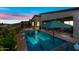 Backyard pool and covered patio area, ideal for evening relaxation and enjoying the colorful sunset views at 830 E Buist Ave, Phoenix, AZ 85042
