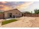 Expansive backyard featuring gravel landscaping, patio, and block fence at 8502 W Pierson St, Phoenix, AZ 85037