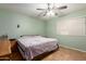 Bedroom with tile flooring, ceiling fan, and natural light at 8502 W Pierson St, Phoenix, AZ 85037