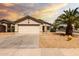 Charming single-story home featuring a low-maintenance desert landscape and a two-car garage at 8502 W Pierson St, Phoenix, AZ 85037